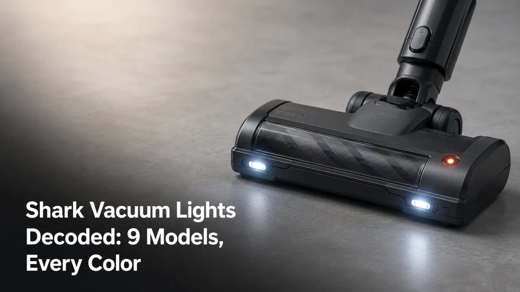 Shark-style upright vacuum head on a studio floor with white LED headlights and an amber-red indicator light, used for a guide to vacuum light colors.