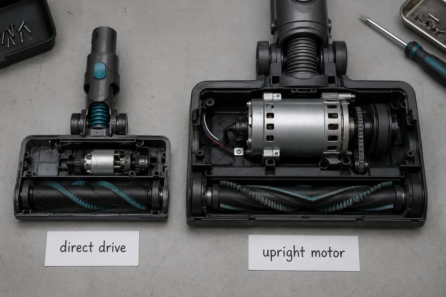 Overhead comparison of an opened Dyson V-series cordless cleaner head with its direct-drive motor and a Dyson Ball upright head with its larger dedicated motor exposed.