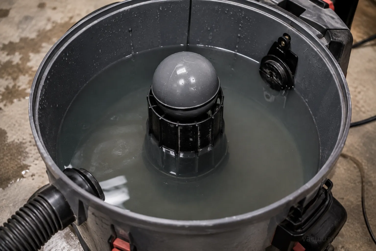shop vac tank filling with water as the float rises during wet pickup setup
