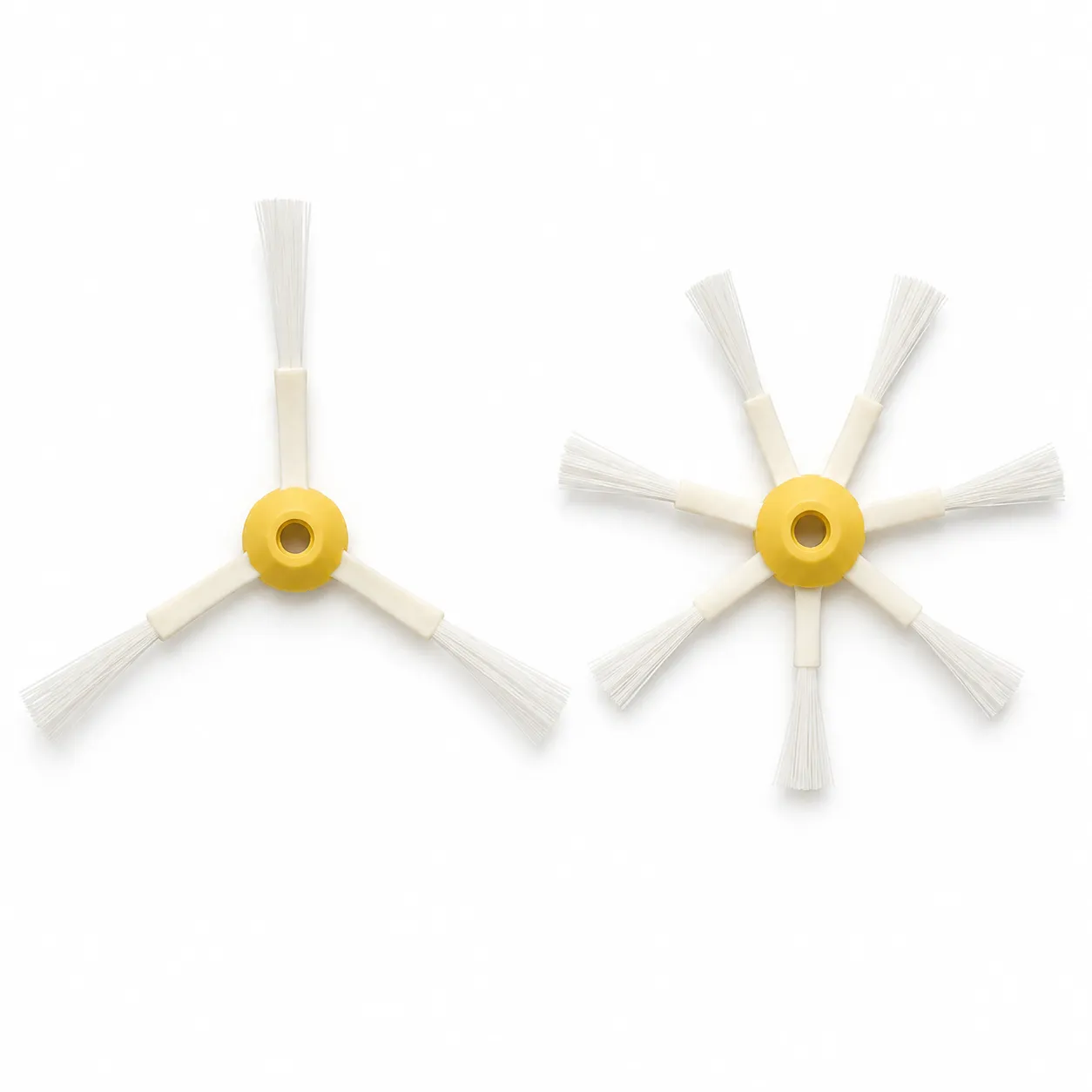 Overhead comparison of three-arm and six-arm robot vacuum side brushes placed side by side on a white background.