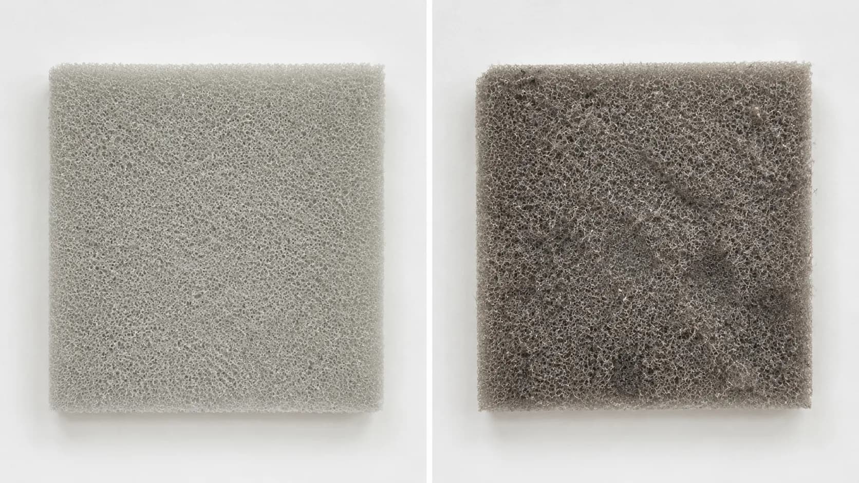 Side-by-side comparison of the same rectangular foam vacuum filter, clean on the left and coated with grey dust after two weeks on the right.