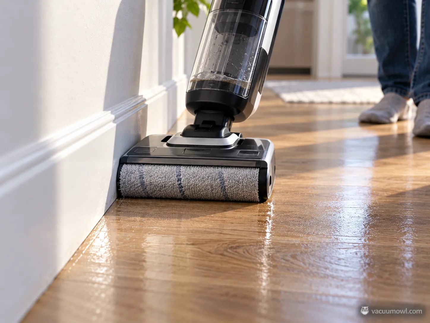 Floor washer cleaning along a baseboard during an edge cleaning test, 2026.